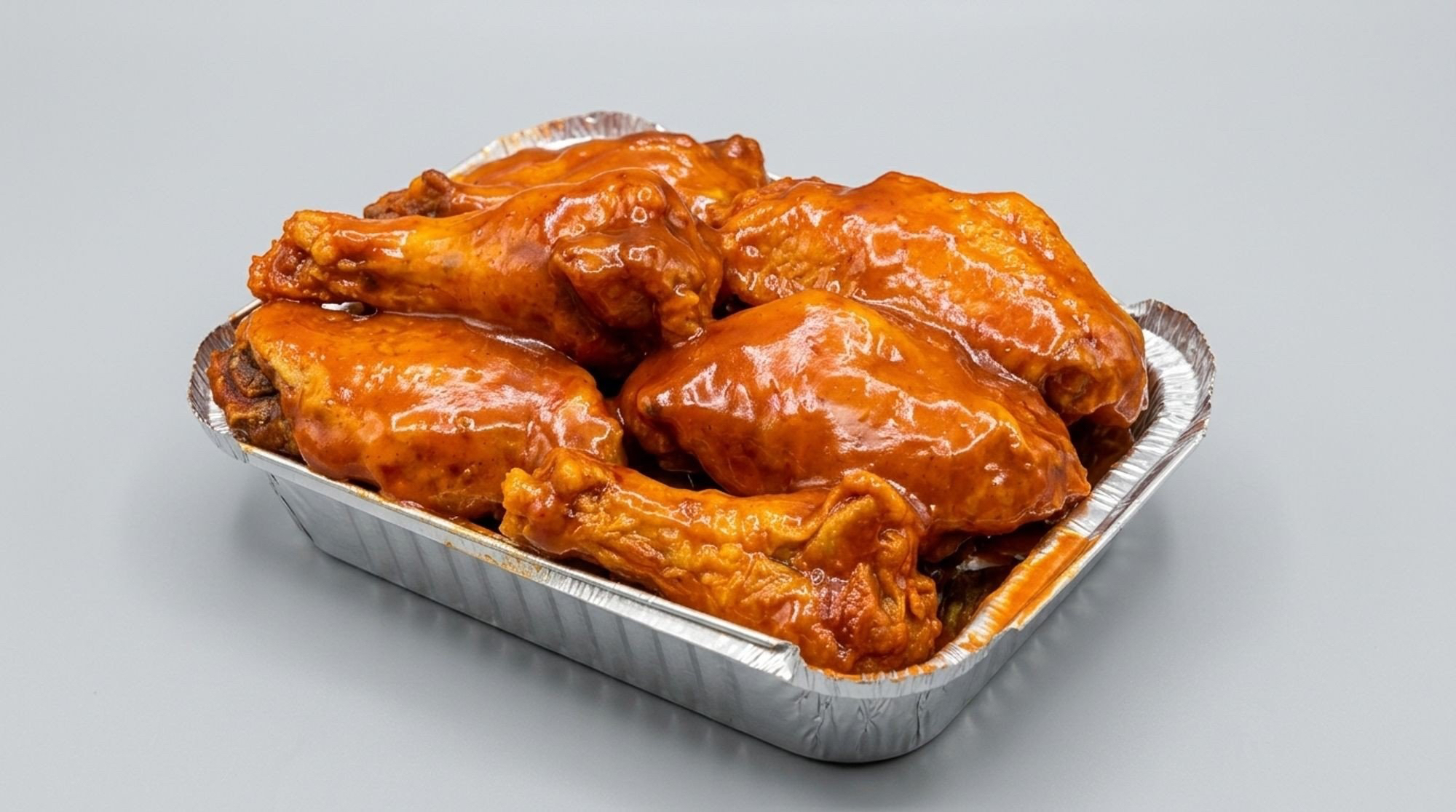 Tray of Wing Chef Classic Buffalo wings glazed in tangy buffalo sauce